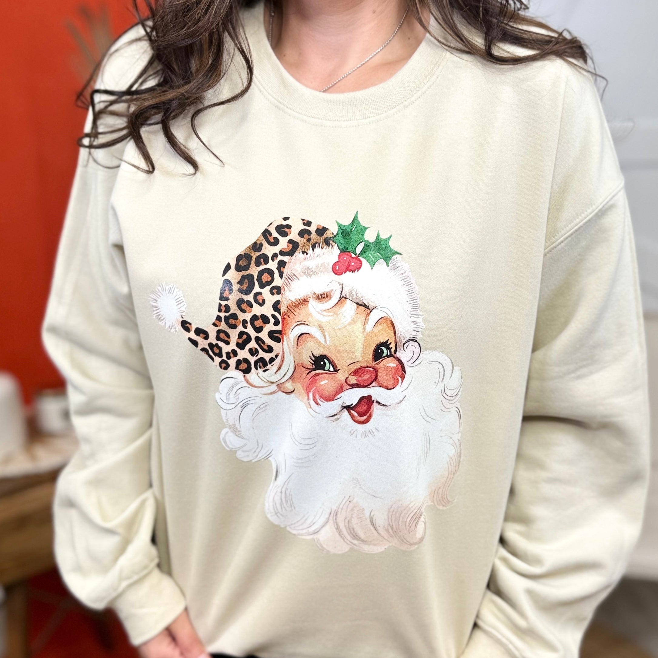 Santa in a Leopard Hat Graphic Sweatshirt-Sand-130 Graphic Tees-Heathered Boho-Heathered Boho Boutique, Women's Fashion and Accessories in Palmetto, FL