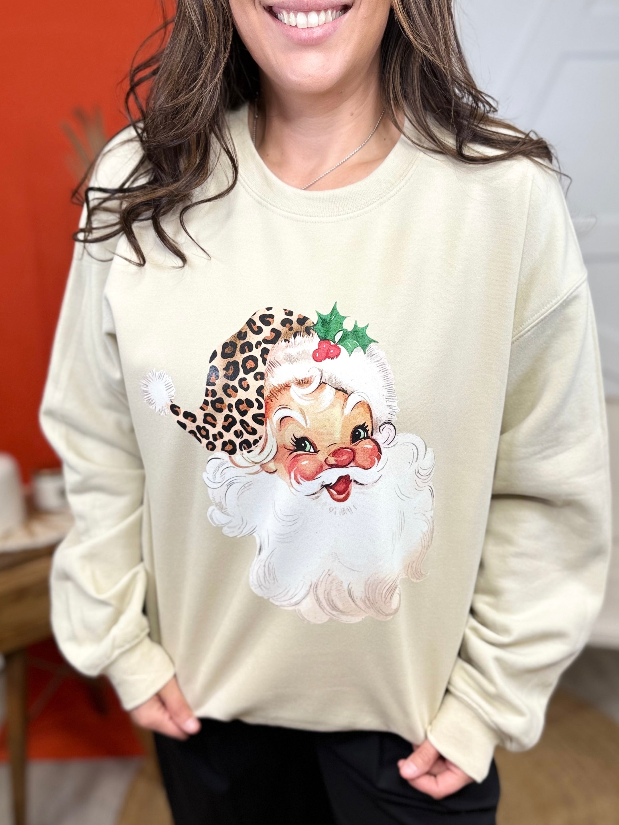 Santa in a Leopard Hat Graphic Sweatshirt-Sand-130 Graphic Tees-Heathered Boho-Heathered Boho Boutique, Women's Fashion and Accessories in Palmetto, FL