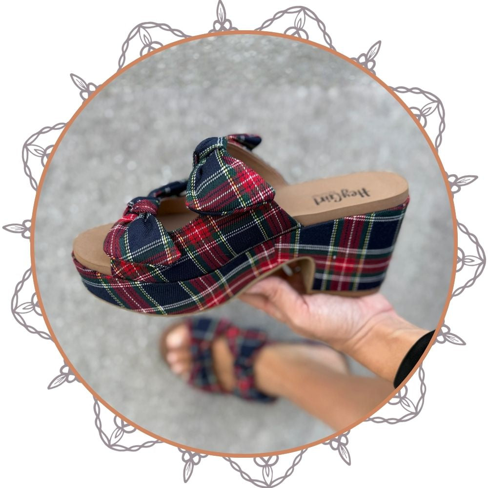 Plaid clog shoe with a platform sole on a neutral background