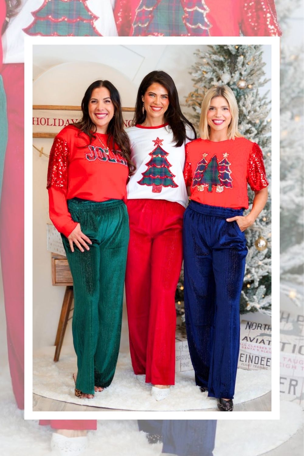 Three women wearing festive outfits with Christmas-themed sweaters in a decorated room.